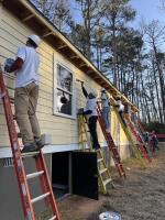 Georgia-Pacific volunteers paint houses